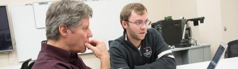 JD Mills and Prof. Mahoney consult on technology ideas