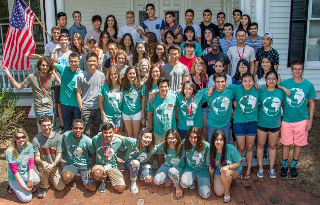 International Students at Orientation Pose on House Steps