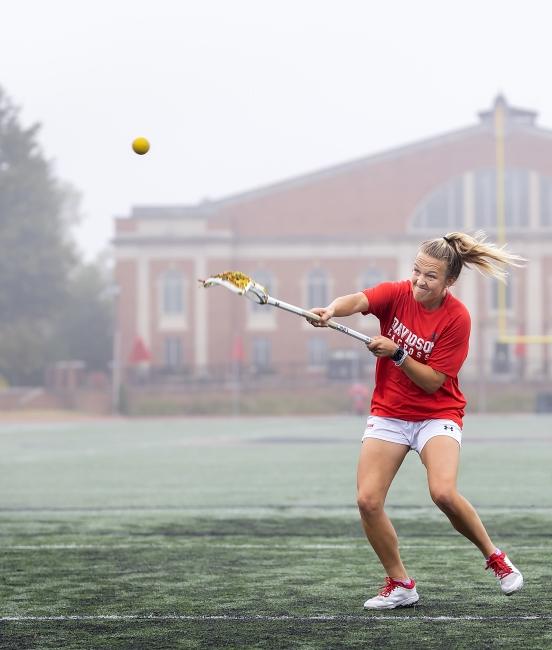Female Student Plays Lacrosse