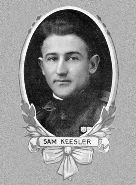 a young white man with brown hair with a banner over his face that reads "SAM KEESLER"