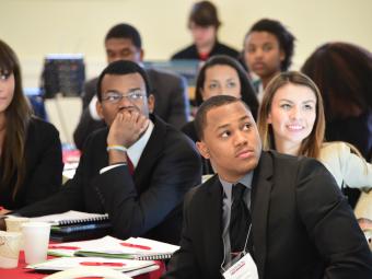 Students listen to a presentation during a career event