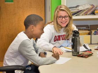 Davidson student with another young student in classroom