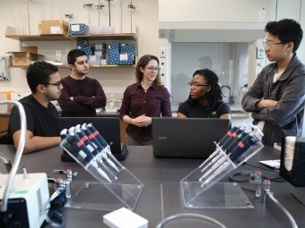 Biology lab professor and students