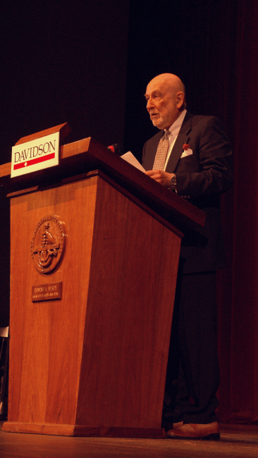 Connaroe speaking at a podium