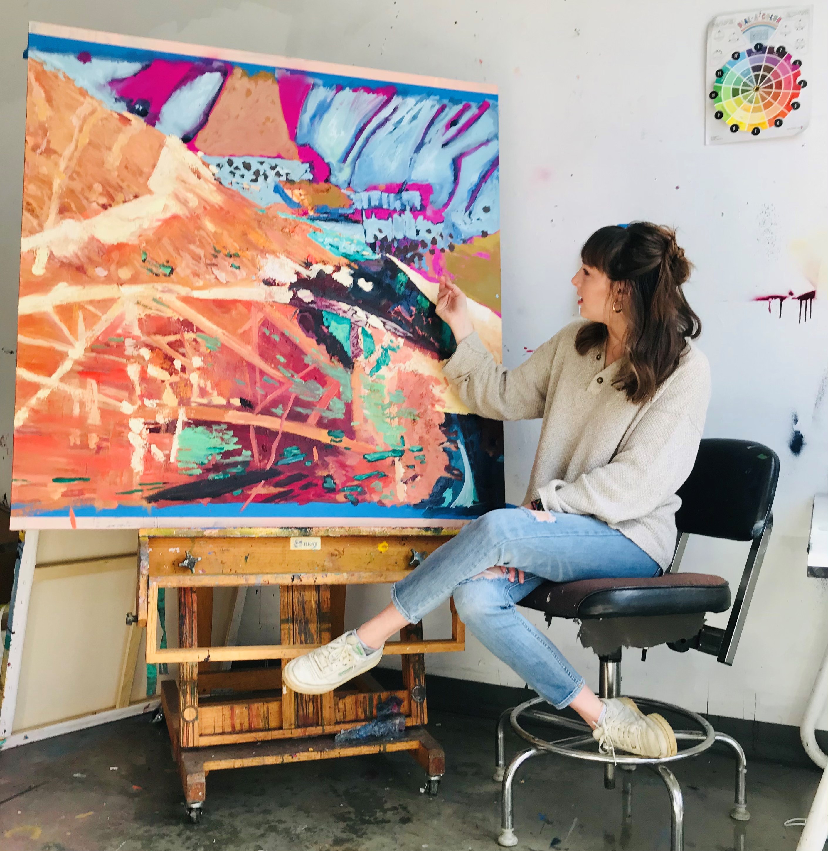 Adelle Patten with a painting