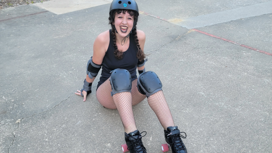 a young woman in roller skates and a helmet smiling