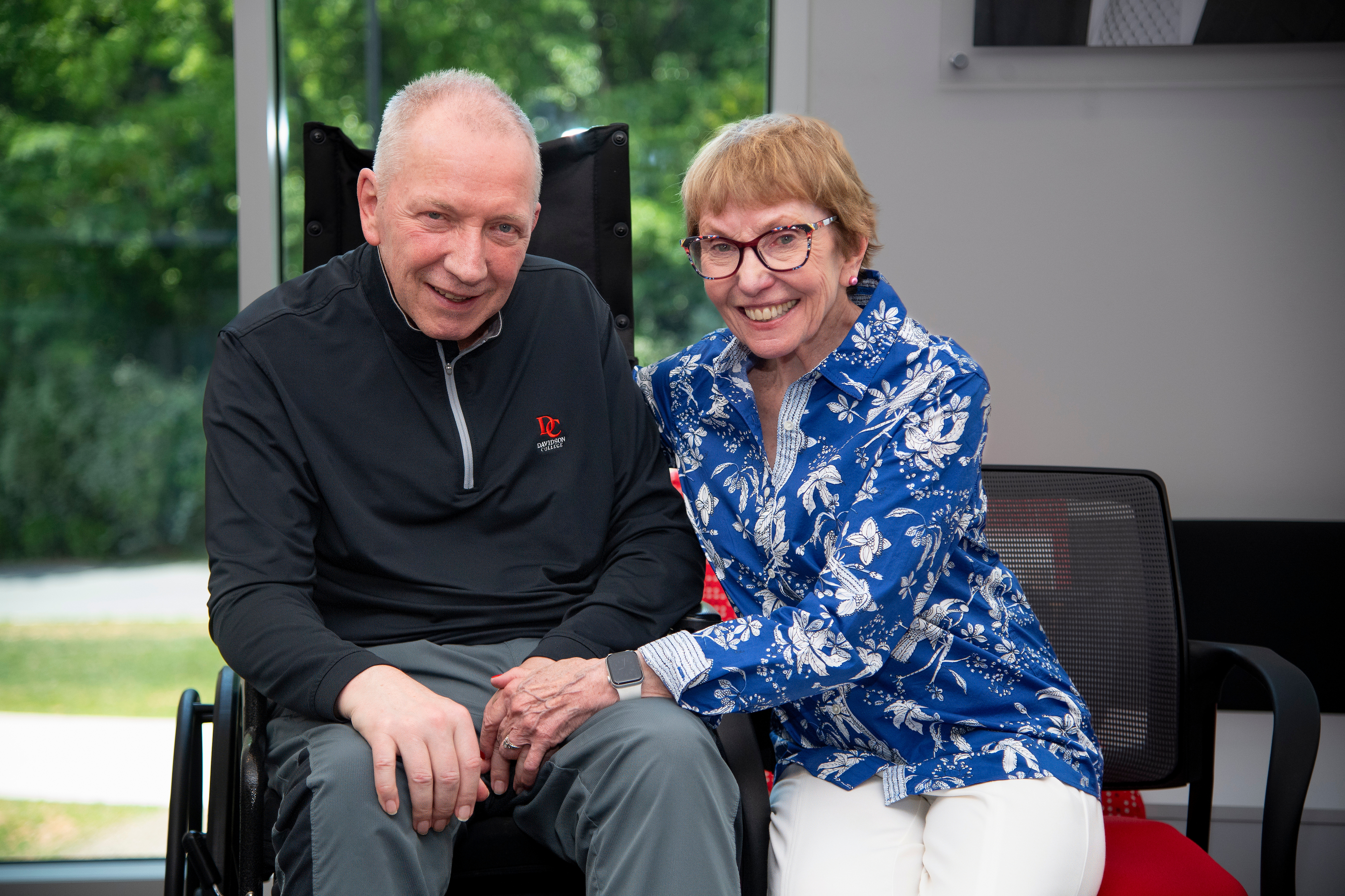 an older white man and his wife sitting together