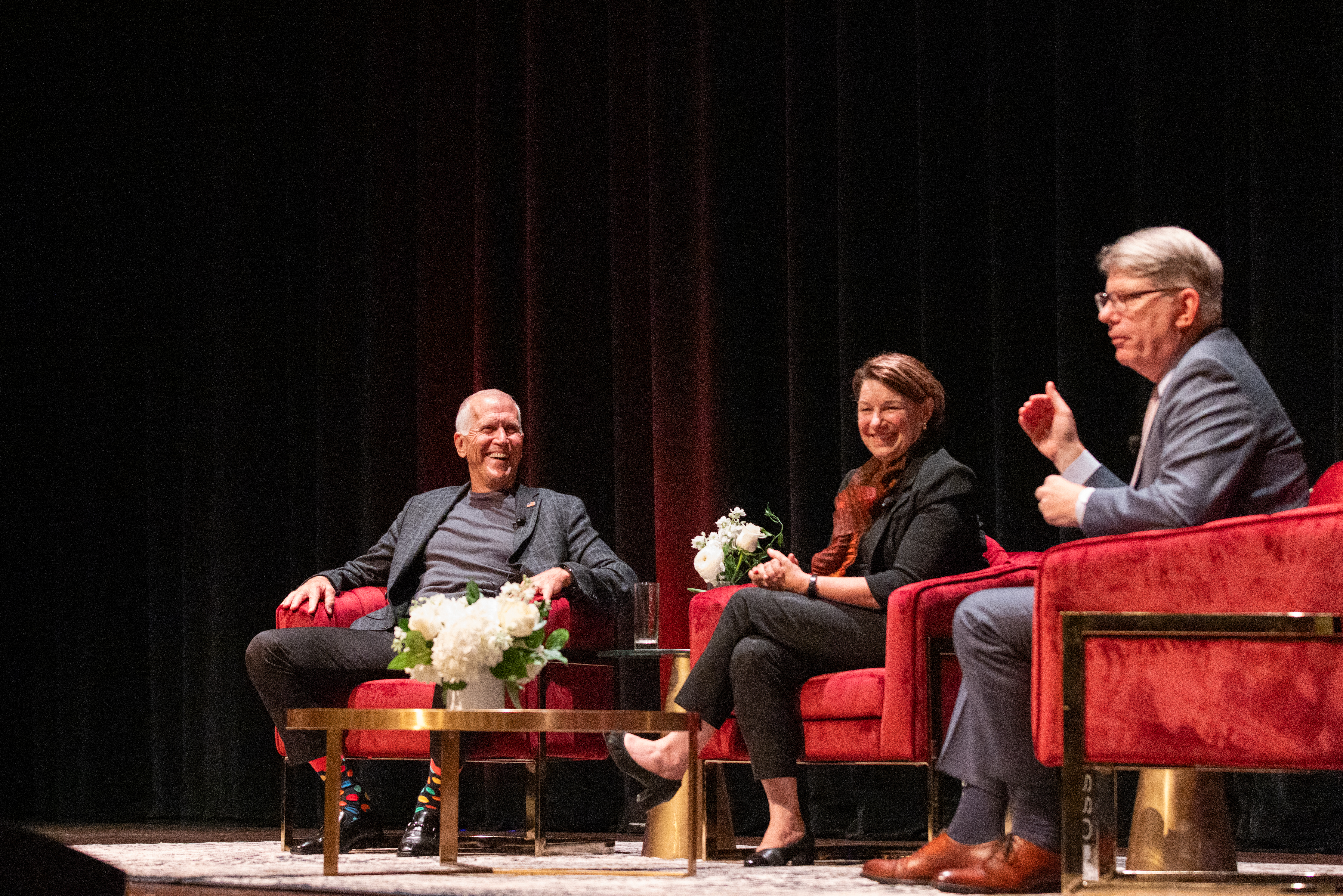 U.S. Senators Thom Tillis and Amy Klobuchar on stage with President Doug Hicks at Davidson College