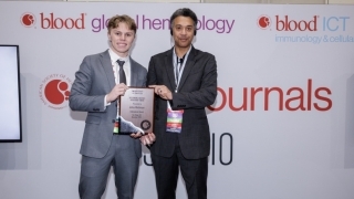 Joshua Wischmeyer, a junior biology major from Denver, Colorado, receiving award