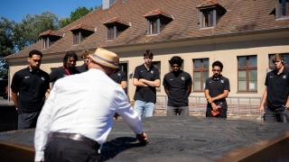 Davidson College Basketball team visits the Sachsenhausen concentration camp.