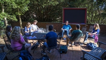 Prof. Keyne Cheshire leads class outside