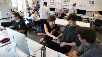 Students talk with professor