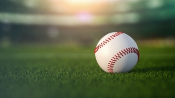Baseball on green grass