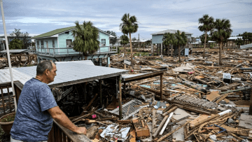 David Hester inspects damages of his house on Saturday after Hurricane Helene made landfall in Horseshoe Beach, Fla.