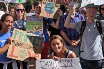 Students holding signs at climate strike
