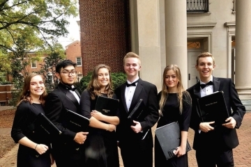 Fenner with members of the Davidson College Chorale