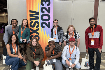Group of students standing in front of a sign that says "SXSW"