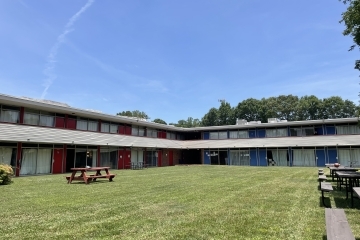 a large apartment complex with a courtyard in the center