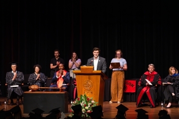 Convocation 2025 students, faculty and staff on stage 