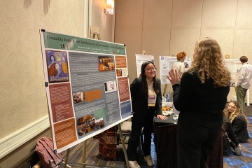 a young woman presents at a conference
