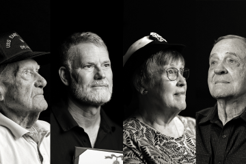 Four people of varying ages look away from the camera in stark lighting