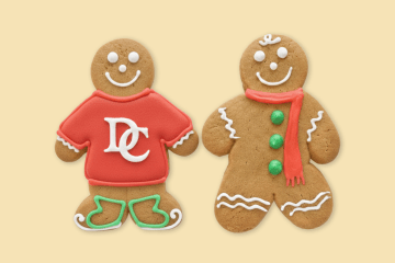Two gingerbread people with red, white and green icing