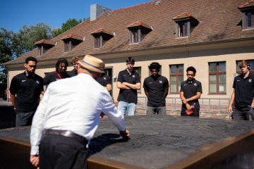 Davidson College Basketball team visits the Sachsenhausen concentration camp.