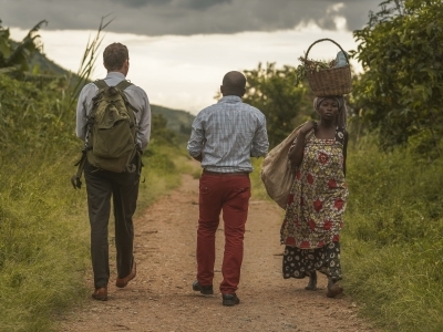 Ross Boyce with people from Uganda walking to water