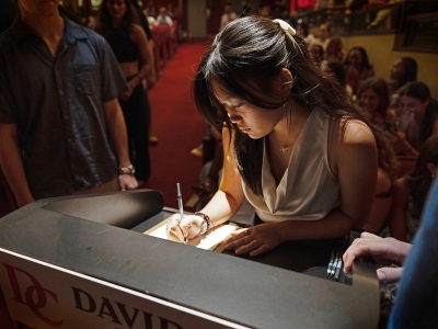 Honor Code Signing 2025 student signs her name