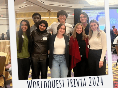 a group of students standing together at an event smiling