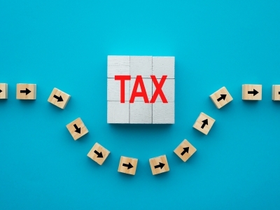 Blocks on a blue background. Arrows avoiding the word "TAX"