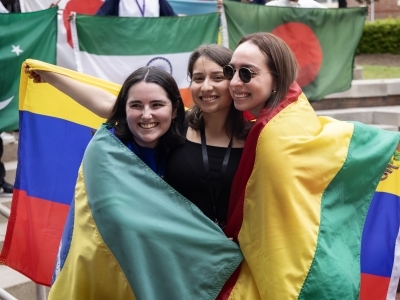 Students draped in international flags