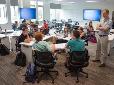 Prof Graham Bullock leads a group of students in a Wall Center classroom