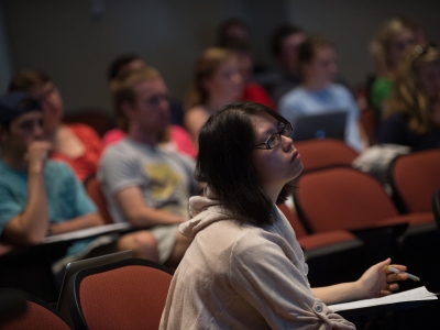 Student in a lecture hall watching the professor