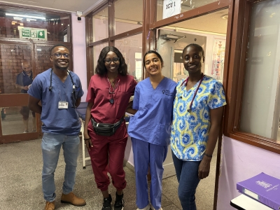 Sahaana Sai Rajagopalan '28 in Zambia standing with other health care professionals