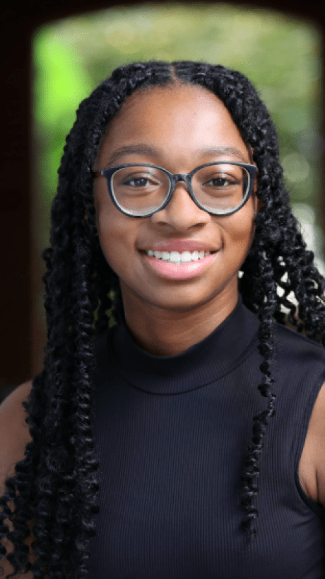 a young Black woman wearing glasses