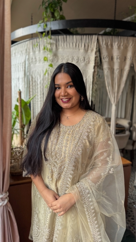 a young woman with long dark hair smiling
