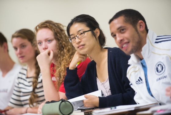 Photo of five students listening to a class lecture