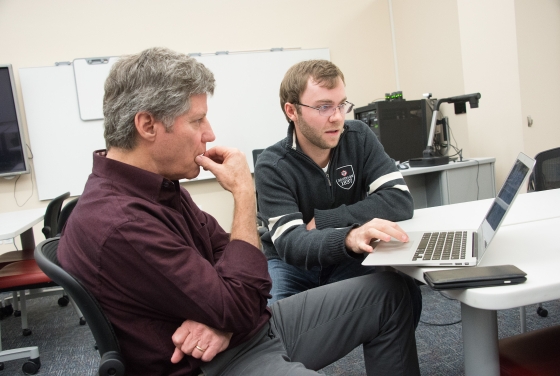 JD Mills and Prof. Mahoney consult on technology ideas