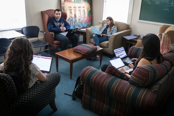 Group studying humanities gather and discuss class topics