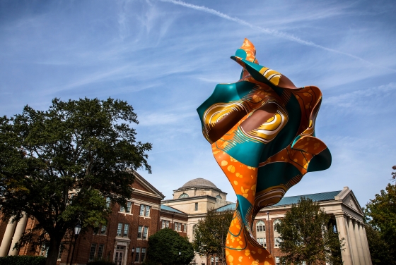 Wind sculpture in the foreground with Chambers in the background