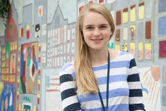 Davidson Stapleton student poses by painted wall