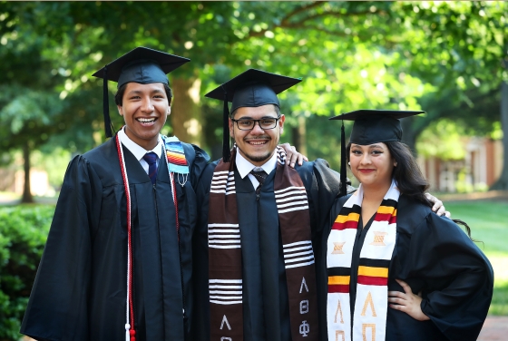 Charles Scholars pose in regalia
