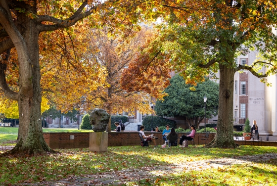 campus scene in front of colorful trees