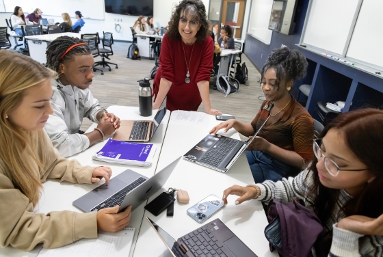 Students in a classroom with Professor of Biology Karen Bernd