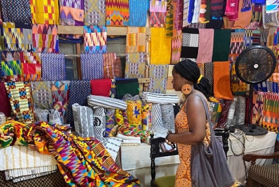 Kasha Salia looing at fabrics in a Market during the Davidson in Ghana program