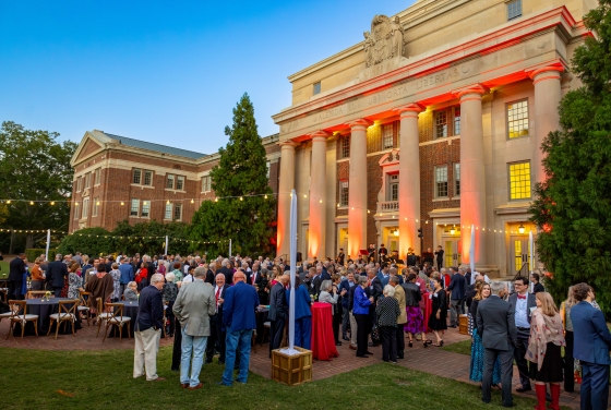 an evening event with string lights on a college campus