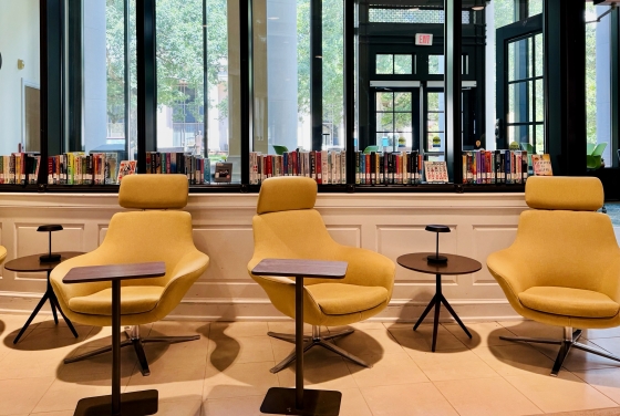 Yellow chairs in the Temporary Library space in Lilly Gallery
