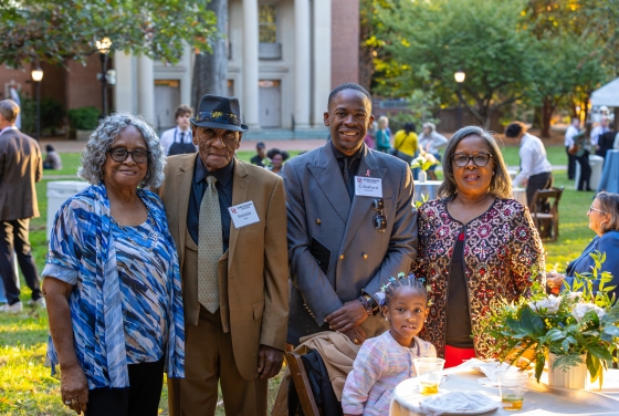 family and caregiver photo on chambers lawn