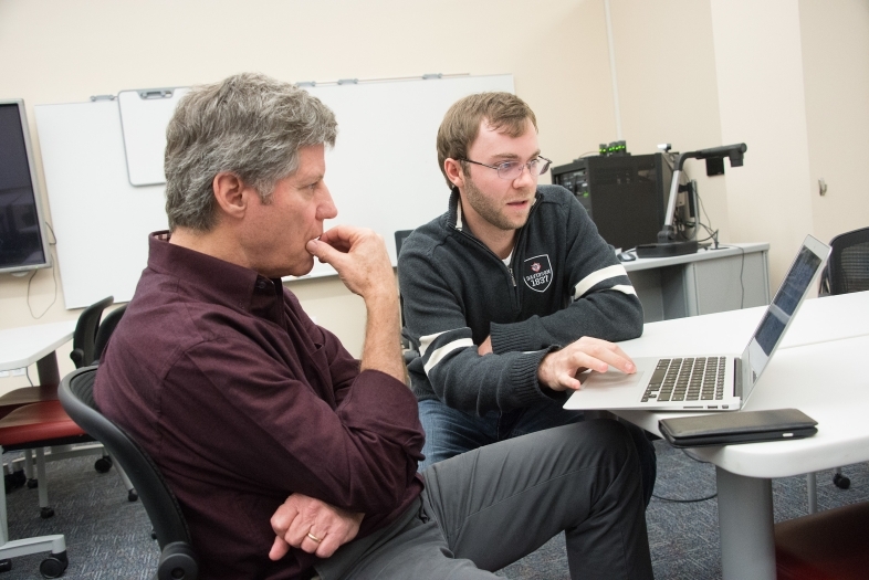 JD Mills and Prof. Mahoney consult on technology ideas